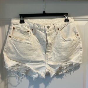 Levi’s 501 white/cream distressed high waisted jean shorts